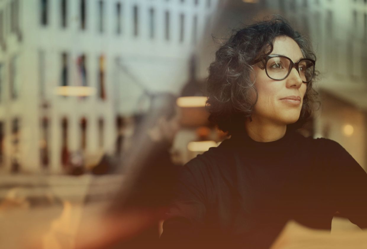 Woman in window with reflection